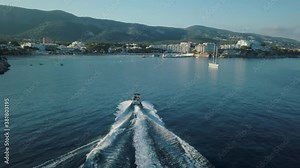 Stunning drone footage in 4k of person wakeboarding in Mallorca - Palmanova beach - Magaluf - Waterskiing - Activities outdoor, Mediterranean Sea, Belearic Islands, Spain