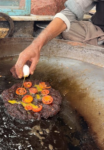 Delicious Kebabs Topped with Tomatoes and Eggs