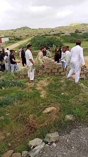 Traditional South Asian Attire in Rural Gathering