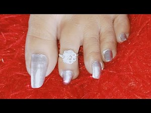painting my long natural toe nails with silver nail polish at home