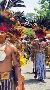 SIMBU WARRIOR The muscular naturally built Simbu warrior in red painted face beating the kundu drum repeatedly, on the foggy top of rocky Mount Wilhelm as morning cricket choirs as Sun horizon reflections emerged from Solomon Sea of Autonomous Region Of Bougainville. Echoes disturbing the sweetest sleep of boy from Bundi.Comes out with his candle inbuilt clay head dress.The joyfully reactions of nature as the cascading Jimi river flows smoothly to the Jimi valley as the Jimians tribes dressed in