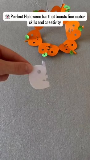 Raising smart and happy kids on Instagram: "This pumpkin paper chain craft is easy, fun, and full of Halloween spirit! Fold your paper like you would for a snowflake, cut out the shapes, and unfold a whole parade of pumpkins holding hands. It’s a great way to practice cutting skills, decorate your space, and get into the spooky season mood together! pumpkin garland, Halloween craft, paper chain, kids craft, fine motor skills, DIY decor, spooky season, easy paper craft"