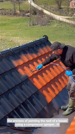 the process of painting the roof of a house using a compressor sprayer...!!!