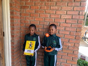 "Let's stand up and stop poaching"… This is 8 year old prefect, Anesu Gwema from Thomas Coulter Primary School in Hwange, Zimbabwe, with an amazing message for poachers. Anesu is the daughter of 2020 Tusk Wildlife Ranger Award Winner Amos Gwema. The first image is of Anesu holding one of our PACE booklets next to her twin sister! We love seeing how our PACE school project booklets are being used to engage children living alongside wildlife. | Tusk