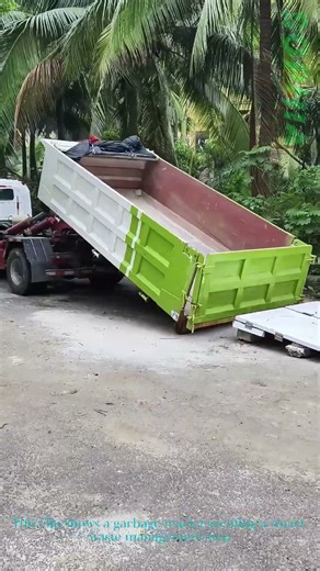 Garbage Truck Drops Empty Bin: Ready to Be Filled for Waste Haul