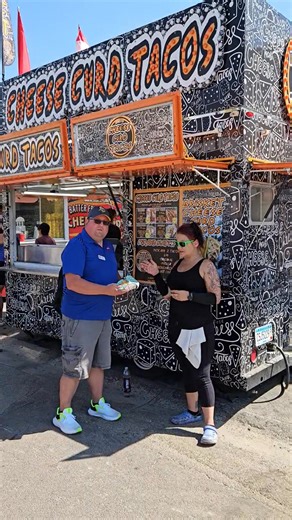 So today I'm at our new fair food family member, Cheese Curd Tacos, and Sassy offered me two of their many options of cheese curd tacos... They offer chicken, steak, brisket, pork, along with lettuce and different types of sauces... They're located right at the main drag intersection in front of the grandstands so go cure your hunger, Sassy and her crew will gladly help you out... Have a great 2nd day at the Steele County Free Fair! | Steele County Free Fair