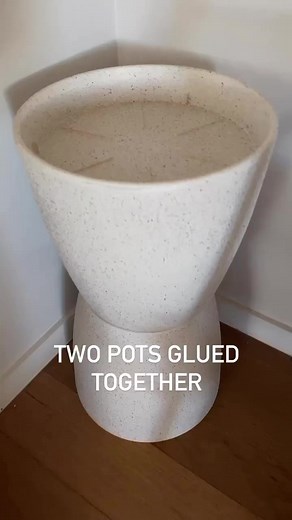 Remember that Kmart wooden mirror I hacked by adding clay balls around the edge? Well, I thought I’d try to turn it into a coffee table by putting it together with a couple of pots as the base. What do you think?😉 | The Bargain Hacker