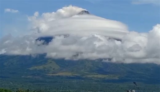 Clouds form a ring at the crater of Mayon volcano as seen from Legazpi, Albay on Friday. Phivolcs has maintained the Mayon Volcano on Alert Level 3 after recording 4 volcanic earthquakes, 307 rockfall events, and 13 pyroclastic density current events. (Video by Edd Gumban/The Philippine STAR) | Philippine Star