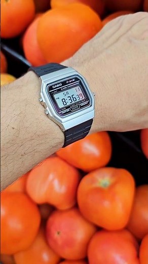 Silver Casio F-91W with Tomatoes