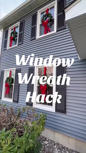 Here’s how we hung our lighted wreaths- no ladder required!! We have double sash windows, so we were able to hang these wreaths from the inside. Watch video for full tutorial. We used the fishing line to hold the wreaths in place so they didn’t swing or flip when the wind blew. #christmas #wreaths #christmasdecor #christmasdecorations #christmashack #holidaydecor #christmaswreath #itsbeginningtolookalotlikechristmas #follow #hacks #christmashouse