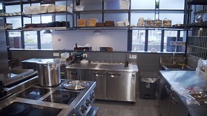 Premium stock video - Slow pan over empty restaurant kitchen