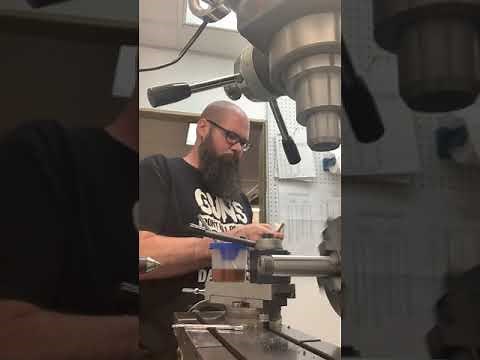 Chambering a rifle barrel.