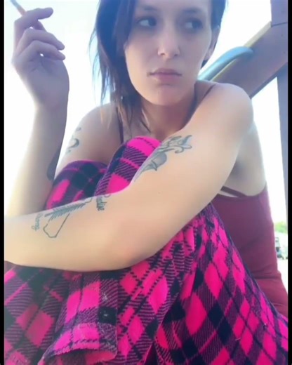 Cute smoking girl with tattoos