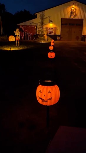 DIY SOLAR PUMPKIN LIGHTS // The path to the Baker’s Barn Halloween Circus is lit with cute pumpkin lights. We used pumpkin pails from Wal-Mart and Hampton Bay “Laurelview” solar lights from Home Depot. Such an easy DIY to light the way for little trick-or-treaters. | It's Me, ChristyB | Facebook