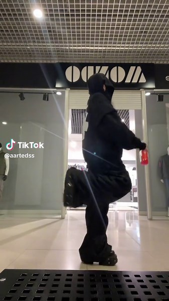 Energetic Dance Performance in a Modern Shopping Mall