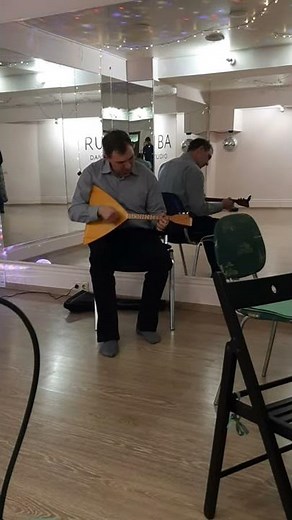 Playing on the Russian balalaika