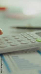 Vertical position. Technologies. The manager uses a modern calculator. A business project management specialist calculates data, new organizational techniques, and analyzes tax returns