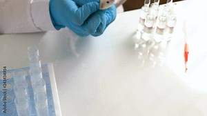 A scientist conducts an experiment on a laboratory mouse. Concept - DNA research, vaccine and drug testing
