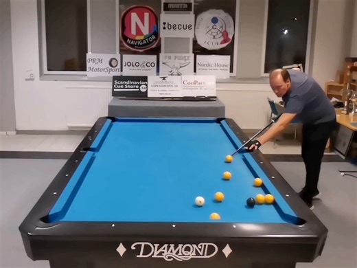 Guy Performs Multiple Trick Shots on Pool Table