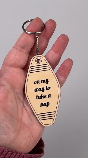 🗝️✨ Let me show you how I made a Motel Keychain using my new @glowforge Aura! I started with light Maple Plywood, placed it on the cutting tray, and used the camera to preview the design on the material. The Aura automatically recognized the material using the QR code, making setup a breeze. The print head then scored and cut the design perfectly. The masking layer protected the wood and made cleanup super easy. After peeling off the masking tape, I added the keychain hardware. It was incredibl