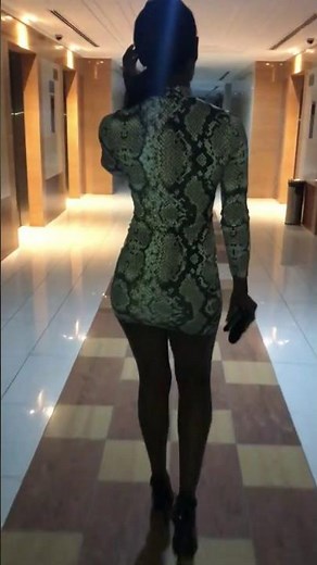 Sexy bubble butt black girl booty walk in high heels and a snake skin dress.