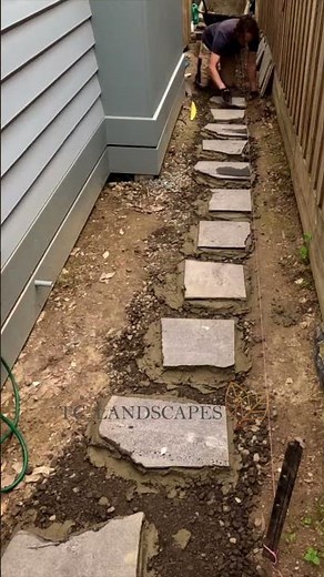 Laying bluestone step stones #backyarddesign #diy #gardenpath
