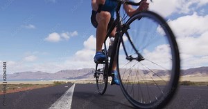 Professional cyclist riding racing bike in race competition on open road. Sports athlete man biking with high intensity on highway during summer cardio workout training. SLOW MOTION, RED EPIC. Stock Video