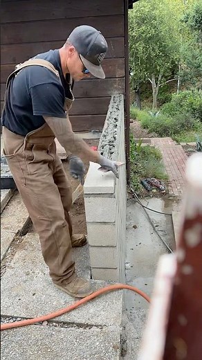 Setting top cap on a concrete block wall. #cmublock #structural #masonary