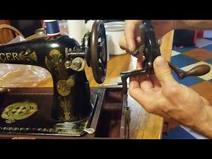 How to attach and remove the handcrank on a sewing machine.