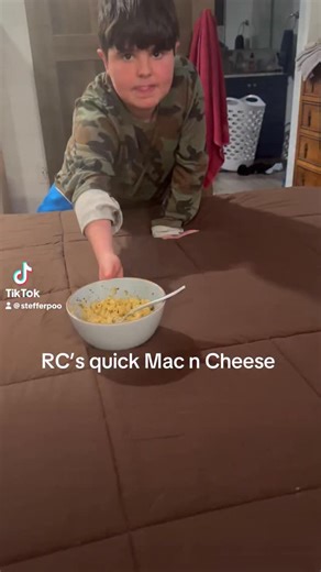 Steffers on Instagram: "RC in the kitchen again 👑🧀 Today he made quick mac & cheese from scratch (no box this time 😏) — just butter, cheese, and his favorite Thanos cheesy seasoning… and listen… it was actually REALLY good. I want to talk about something important though. RC has Duchenne muscular dystrophy and autism. He holds his utensils the way his body allows him to. Some people say he “eats like a toddler.” Some shame him for it. He also eats with his mouth open sometimes because his jaw