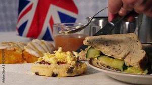 Traditional English tea with scone clotted creams and cucumber sandwiches