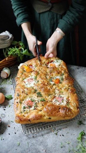 Just baked up one of the tastiest Focaccia recipes ever! I’ve nestled eggs into wells and paired them with a rich roasted tomato sauce for a combo that’s truly divine. But if you prefer keeping things simple, this Focaccia is just as delicious with that rich tomato sauce and eggs on the side. It’s a brunch game-changer! Brunch Focaccia Ingredients For the Dough: 1 1/2 tsp (5g) instant dry yeast 1 1/2 cups 1 tbsp (345g) warm water 1/2 tbsp granulated sugar 3 1/2 cups (450g) bread flour 1 1/2 tsp 