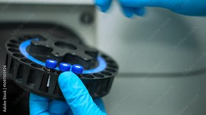 HPLC machine science experiment Vials filling inside an autosampler of an HPLC machine inside view in a Scientific experimental laboratory for research development analysis and ipqa test study