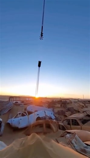 Oleg Pars | Kinetic Fields on Instagram: "Field Notes: December 11, 2025 Location: Atacama Desert Vehicle Graveyard, Chile ⠀⠀⠀⠀⠀⠀⠀⠀⠀⠀⠀⠀⠀ Encounter Summary: The sun was dipping low over the Atacama, casting the sprawling car graveyard in deep violet shadows. I was navigating a dune formed over a crushed bus when the sand beneath me began to liquefy. I witnessed the sudden emergence of Ferrocaulis vibrans, a parasitic anomaly known among the local scrappers as "Wire-Weeds" or "Junkyard Lilies." Th