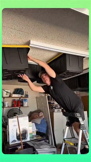 Plastic storage boxes installed on the ceiling,smart overhead space to keep items neatly organized.