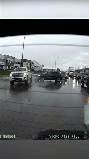 Heavy traffic in the rain caused low visibility