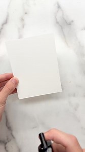 Make an easy DIY Christmas card with me!🎅🏼✨ I started off by embossing my cardstock using the Sparkling Snow 3D Embossing Folder. Then, I ink blended the debossed design using several colors of Simon Hurley inks to create a night sky. This leaves the background colorful and highlights the snowflakes by making them lighter! To finish off the background, I watered down Lunar Paste to a thin consistency and splattered it on. Once dry, the splatters look like stars and add tons of shine all over t