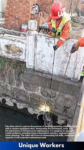 Drain Inspection Work: Worker Pulls Inspection Camera from Underground Drain