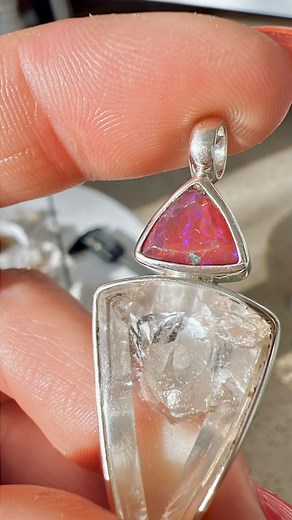 ✨ Ember — Where Dreams Meet Fire ✨ Like a spark in the darkness, Ember was born to awaken your passion and guide your path. At her heart lies Manifestation Quartz — a crystal within a crystal — a rare natural wonder that cradles new visions in pure light. Clarity in its highest form, aligning your mind and spirit so your deepest dreams can take root and bloom. Wrapped in the warm glow of Mexican Fire Opal, Ember blazes with the colours of a molten sunset. Her energy is bold yet nurturing — ignit