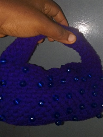 Handmade crochet donut bag 🍩🧶 Made with thick acrylic yarn for structure and durability. Beaded details added by hand ✨ By Loops by Ivy 💰 ₦15,000 📩 DM to order #crochet #fypシ゚viral #handmadebag #crochetbag #crochetartist🧶