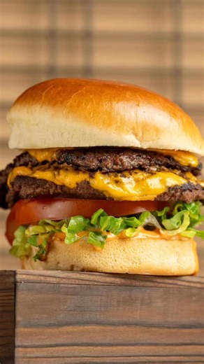 Our Burger, smashed or classic? Take a dip! Two Beef burger patties, seared or smashed to perfection with government cheese, lettuce, tomato, onion, pickles and Chef Paul’s signature Wahl Sauce🍔🍔 | Wahlburgers