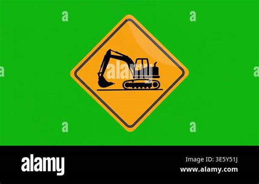 A yellow diamond-shaped warning sign featuring a black excavator icon, isolated on a green screen background Stock Video Footage - Alamy
