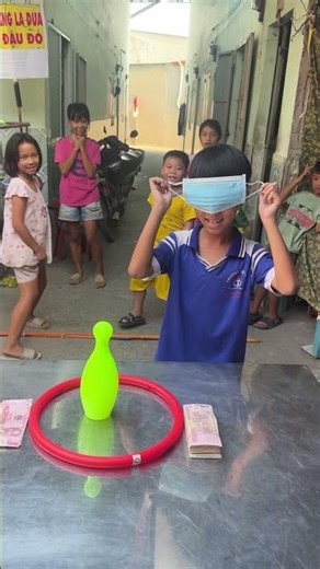 Thien and the whole group competed in a blindfolded bottle-placing contest to win prizes. #youtub...
