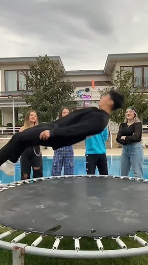 Trampoline Fun in Backyard with Friends