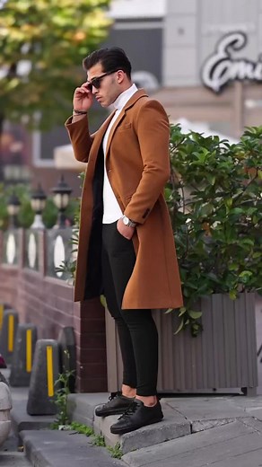 Timeless Fashion: Brown Trench Coat, Black Pants, Sleek Black Sneakers