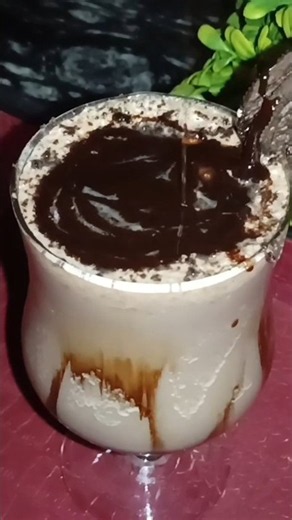 Classic homemade Oreo chocolate shake cold milk, cocoa powder or chocolate syrup, sugar ice cubes.