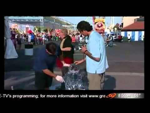 TV reporter knocks over ice sculpture
