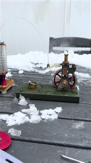 Model steam engine running in the snow #steamtoys #ministeamengine