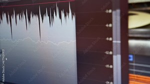Computer monitor screen of a sound engineer showing audio tracks for mixing new soundtrack