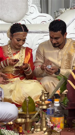 Dhuwithra Tambusamy on Instagram: "Our wedding day 🤍 Every time I watch this, I smile. Amidst the havoc and the unfinished moments, it still reminds me how beautiful it felt to be a bride. . Every bride is the most beautiful bride ever—and I felt that day with my whole heart - I was the most beautiful bride. I smiled, laughed endlessly, and was so happy sitting beside my handsome man. Sometimes, I wish I could go back and relive this exact moment. . #ourwedidngday #ddsailaway🐬🐝💙💜 #adayclose